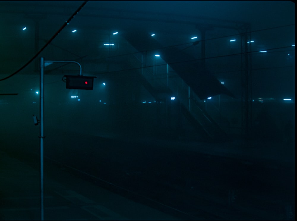 a train traveling down train tracks at night