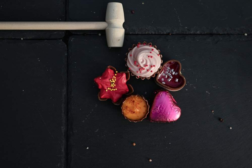 a close up of a cupcake on a black surface