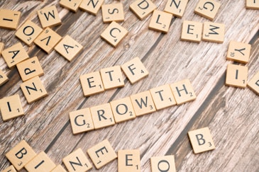 a group of scrabble tiles spelling the word growth