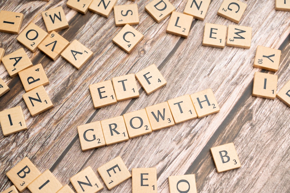 a group of scrabble tiles spelling the word growth