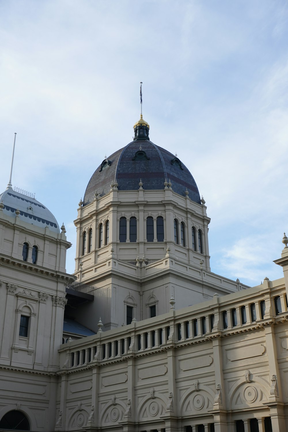 a large white building with a blue dome