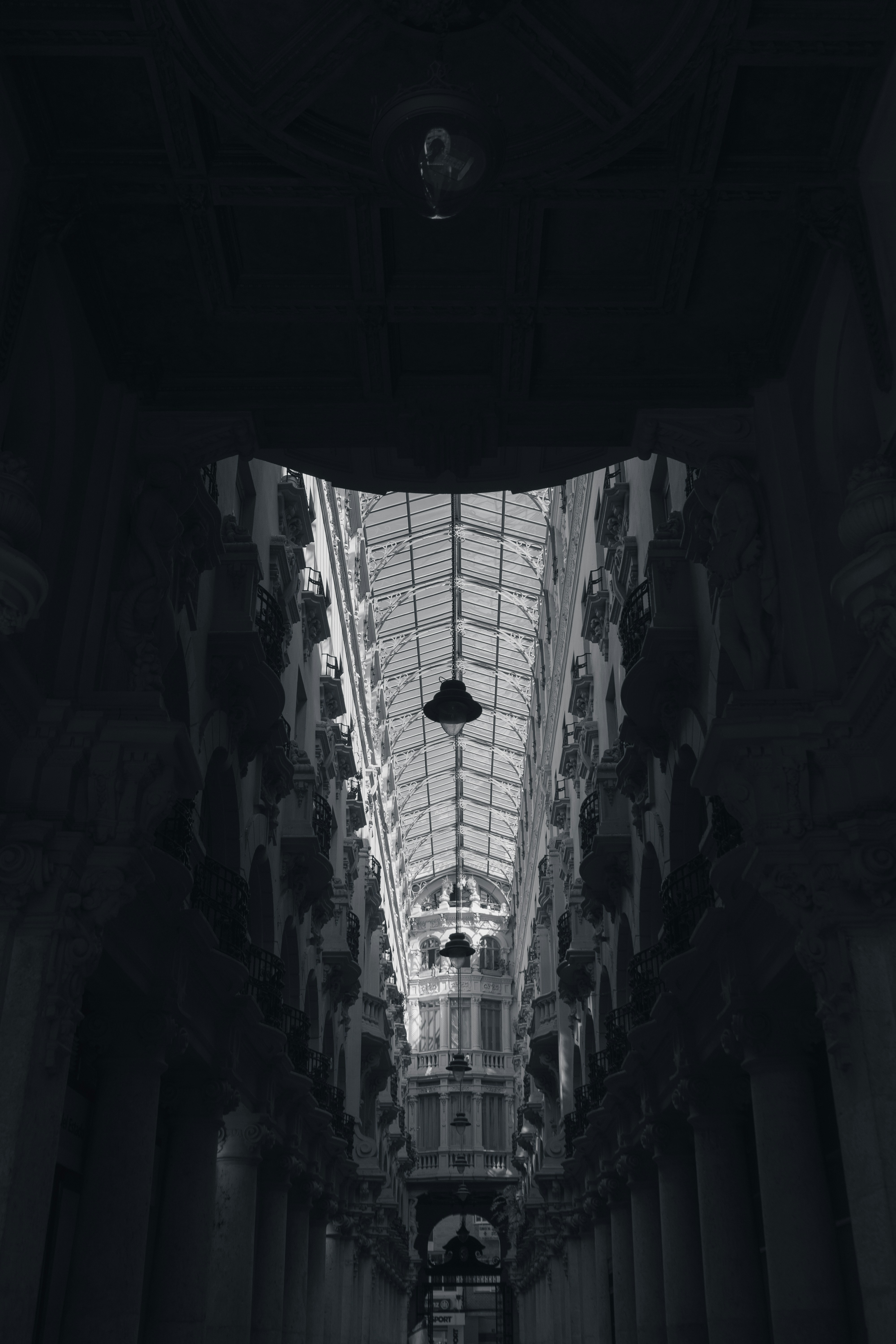 a black and white photo of a building with a skylight