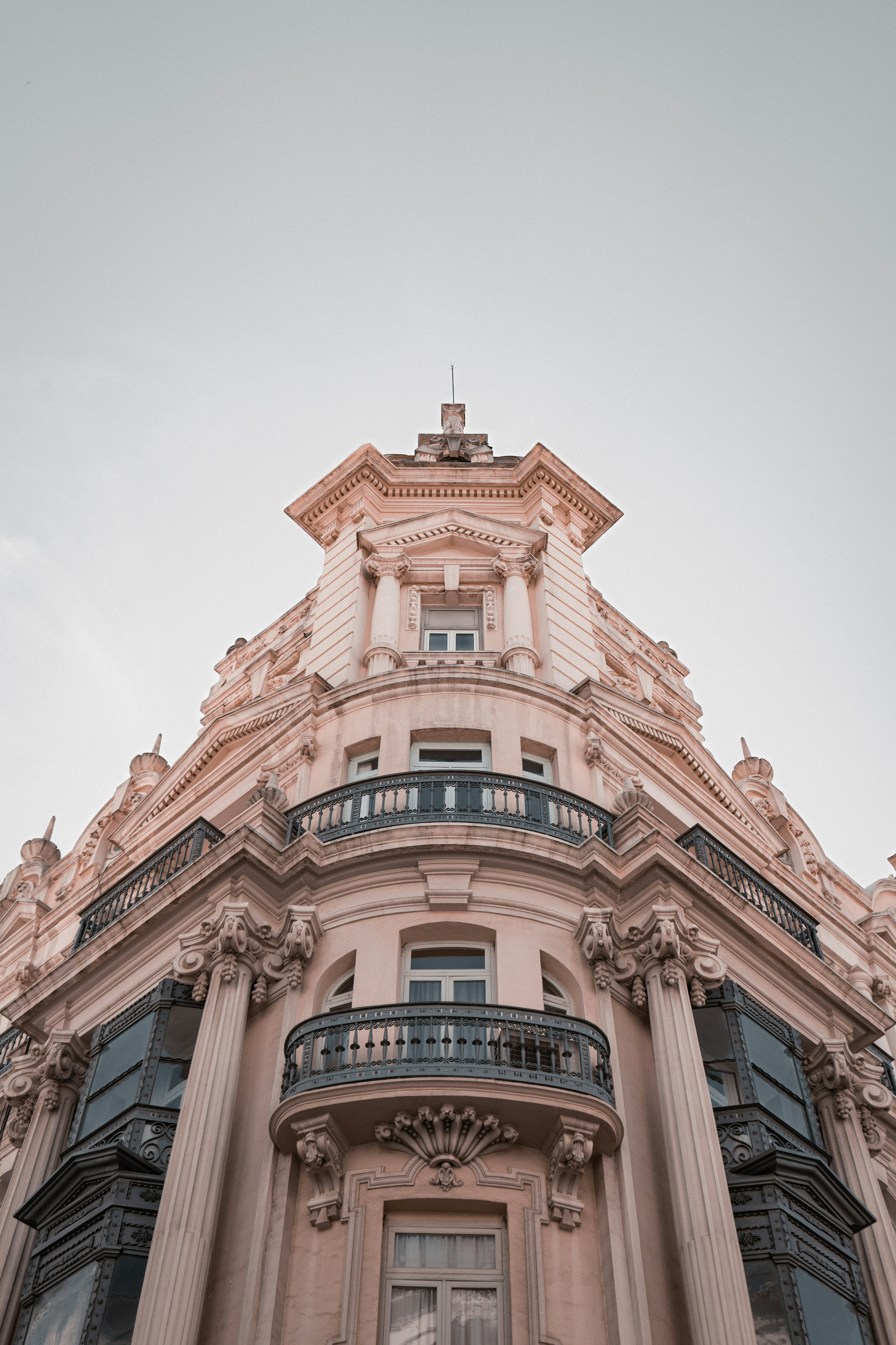 a tall building with a clock on the top of it