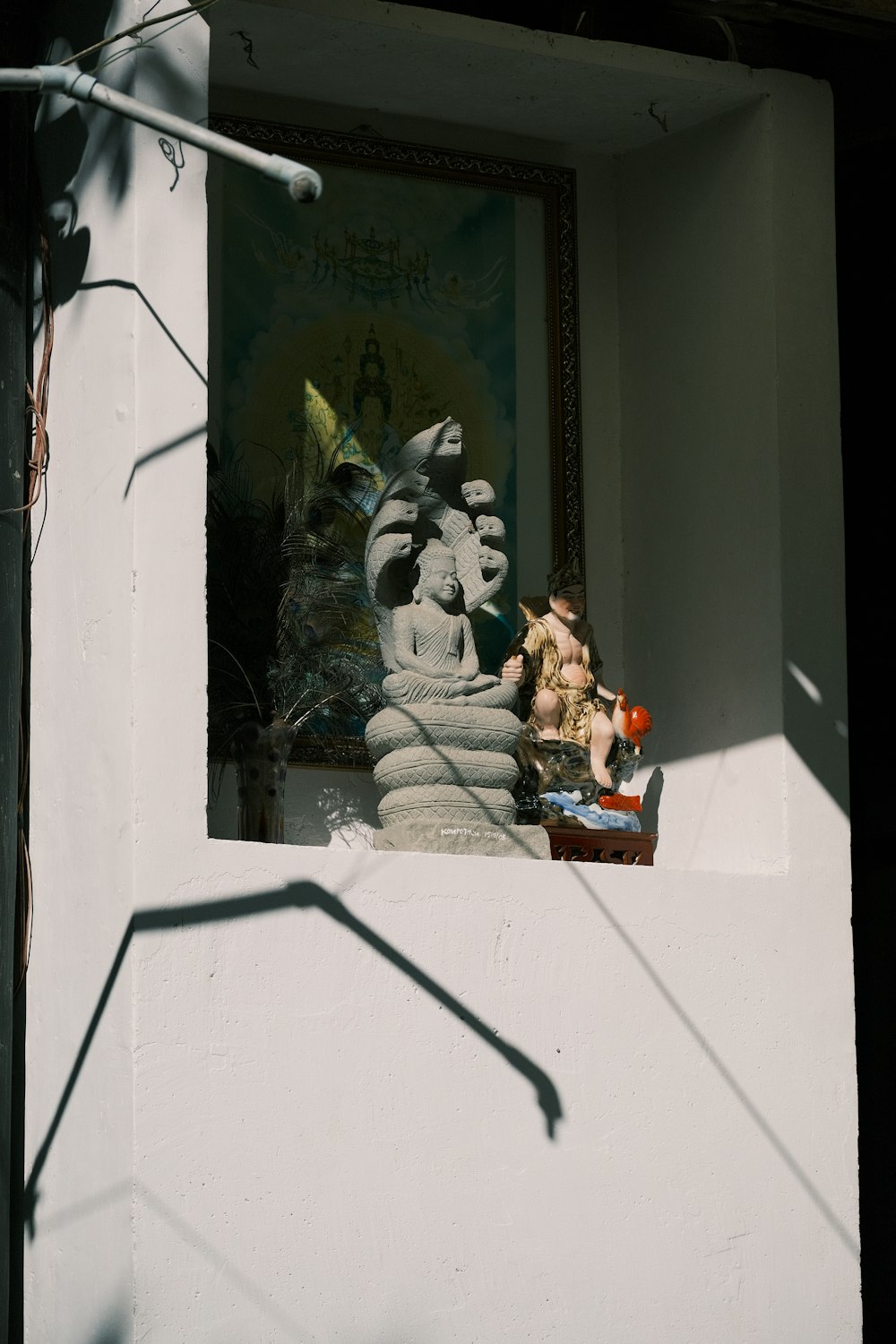 a statue of a man and a woman in a window