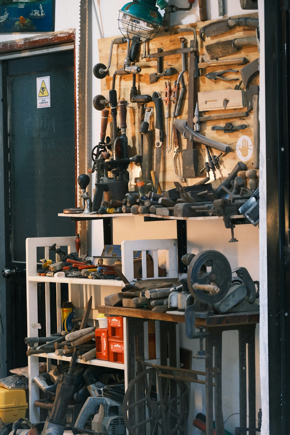 a bunch of tools that are on a shelf
