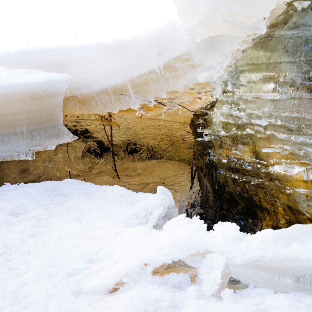 a large piece of wood sitting on top of snow covered ground