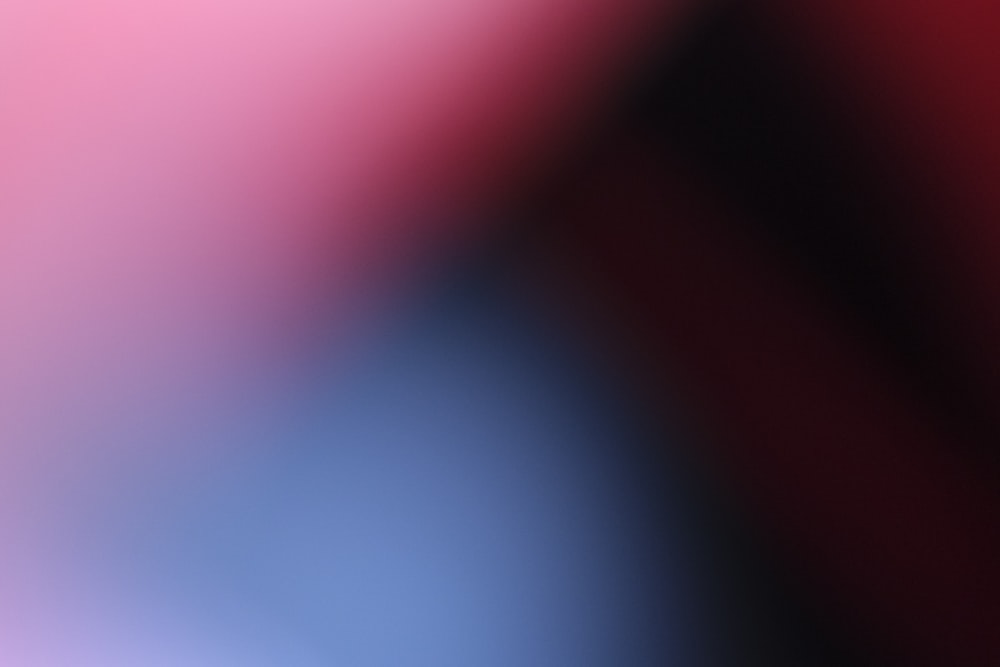 a blurry image of a red and blue background