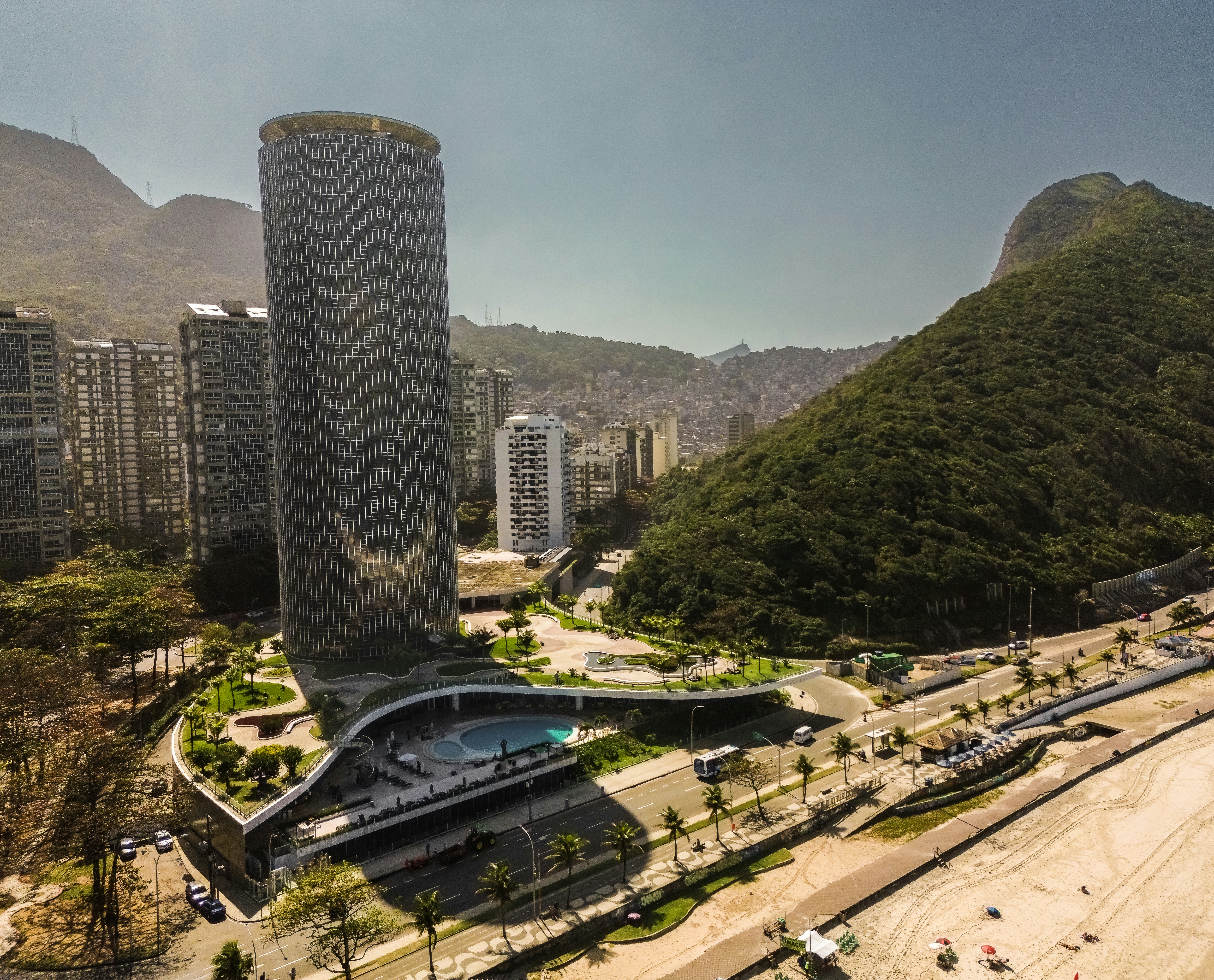 an aerial view of a city with mountains in the background