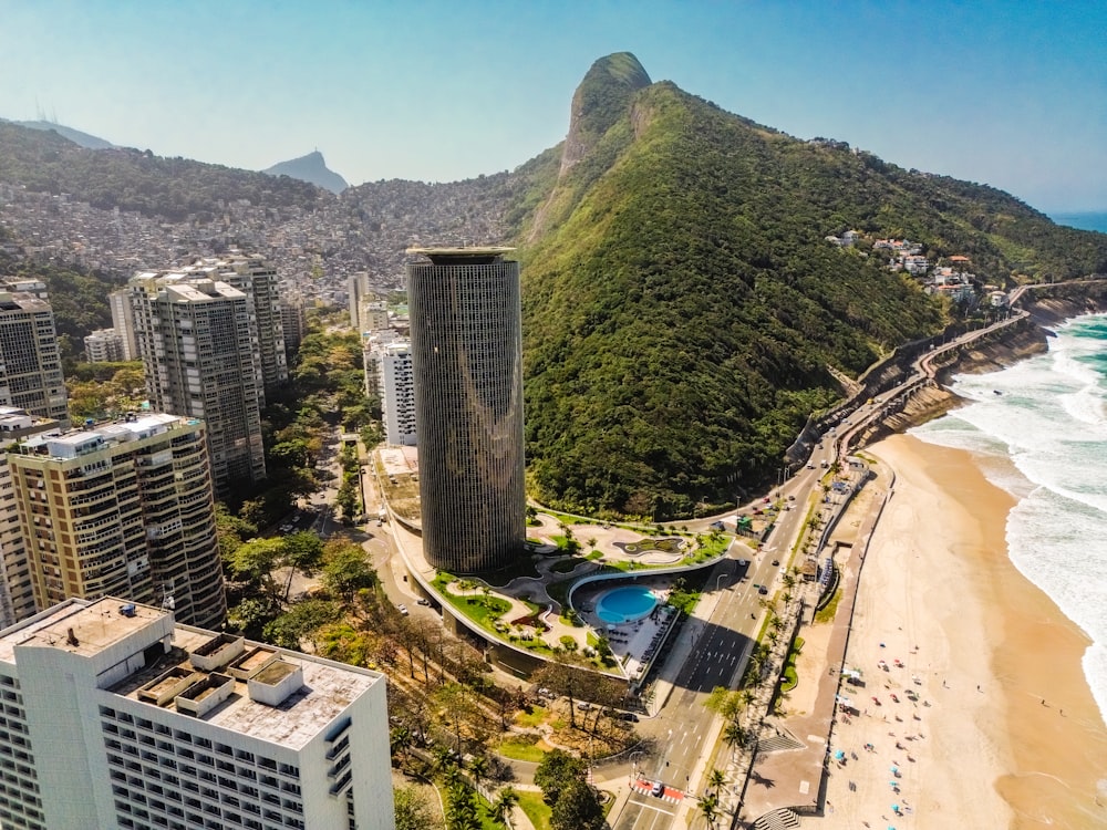 an aerial view of a city with a mountain in the background