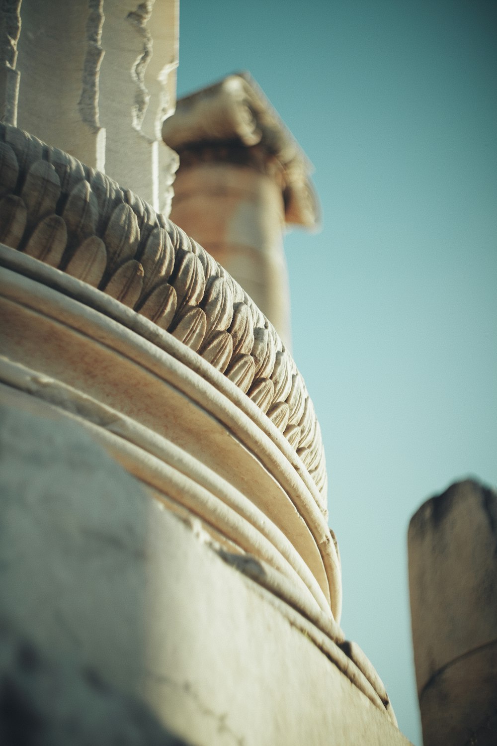 a close up of a column with a sky background