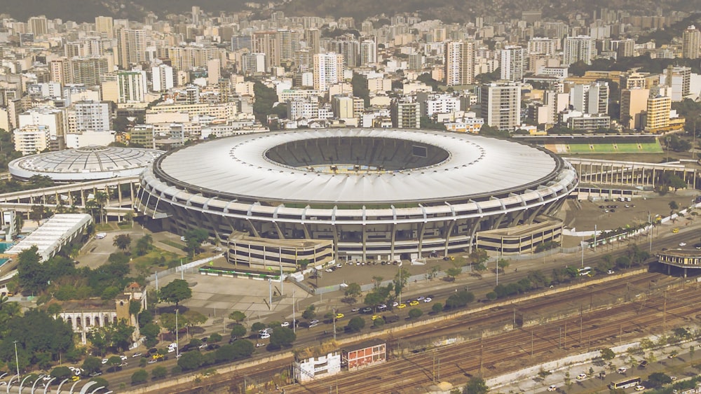 an aerial view of a soccer stadium in a city