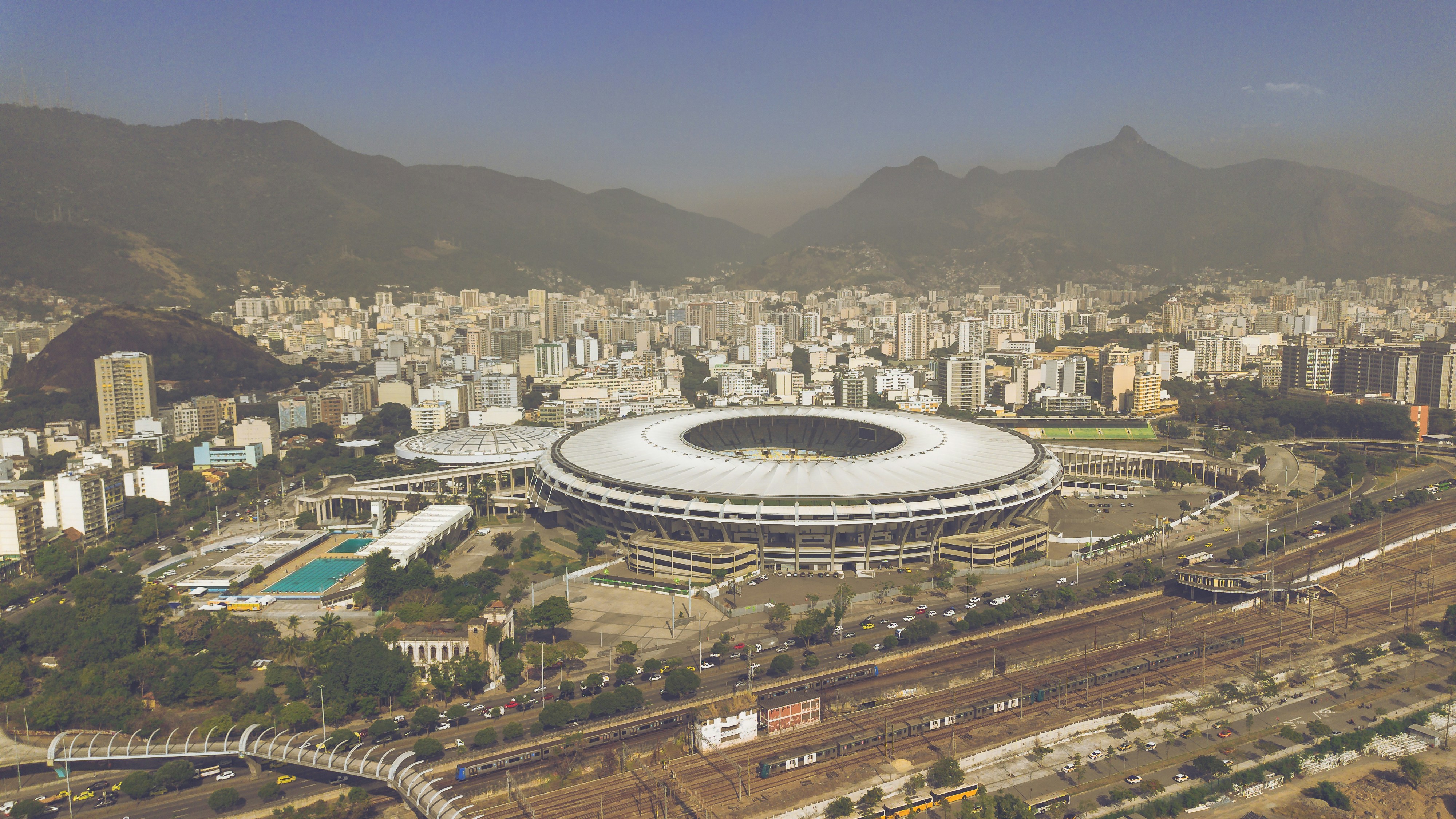 an aerial view of a stadium in a city