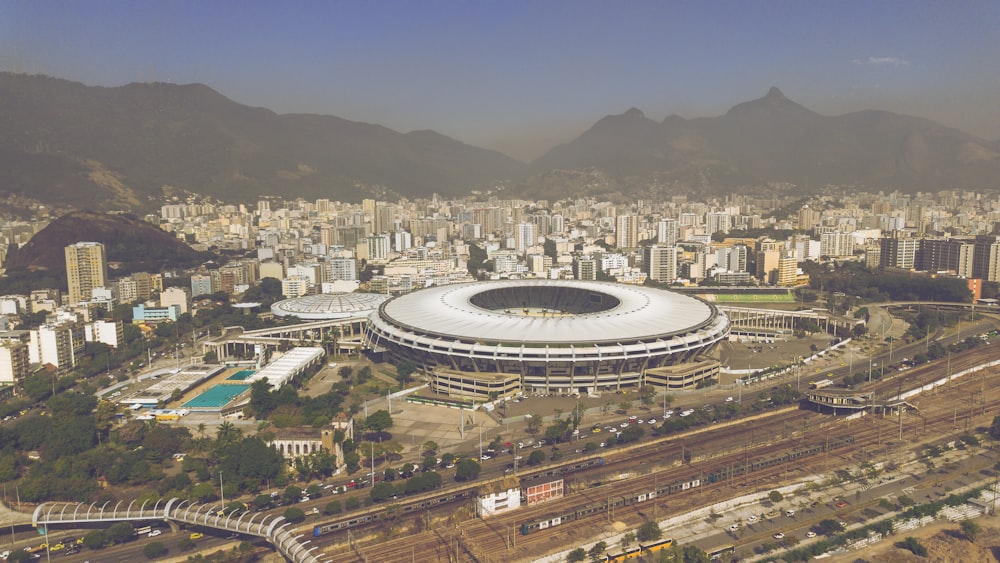 an aerial view of a stadium in a city