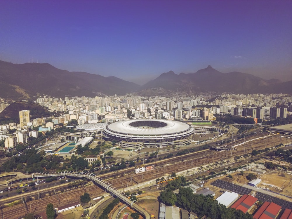 an aerial view of a stadium in a city