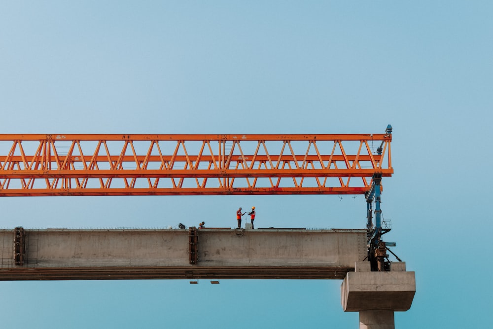 two men are working on a construction project