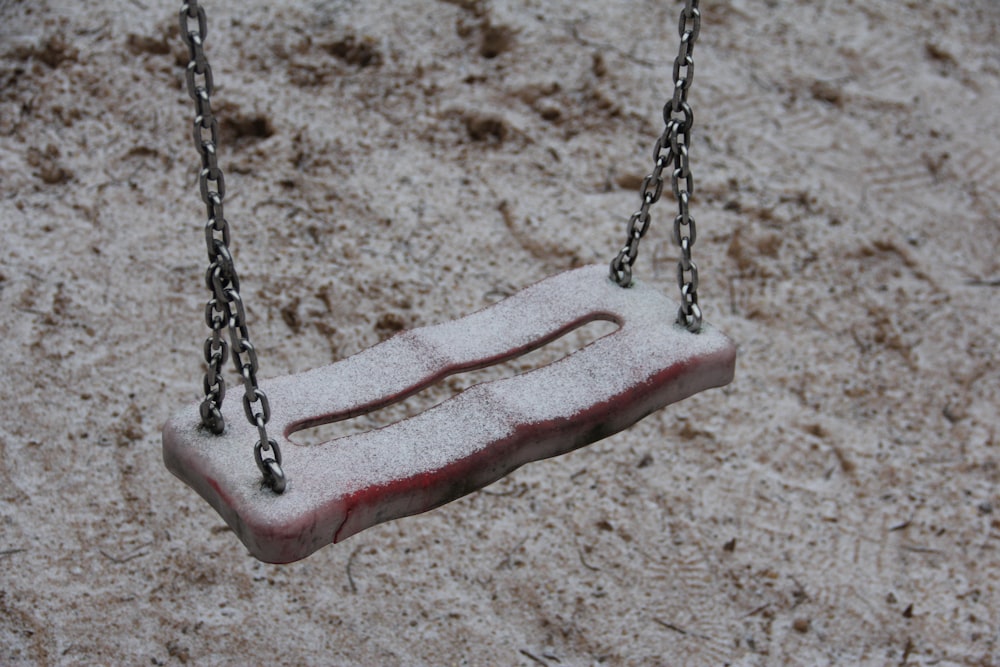 a swing that has a piece of ice on it