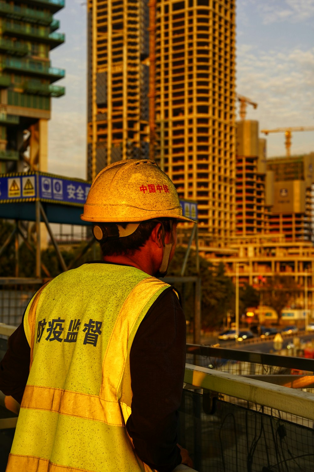 a man wearing a hard hat and safety vest