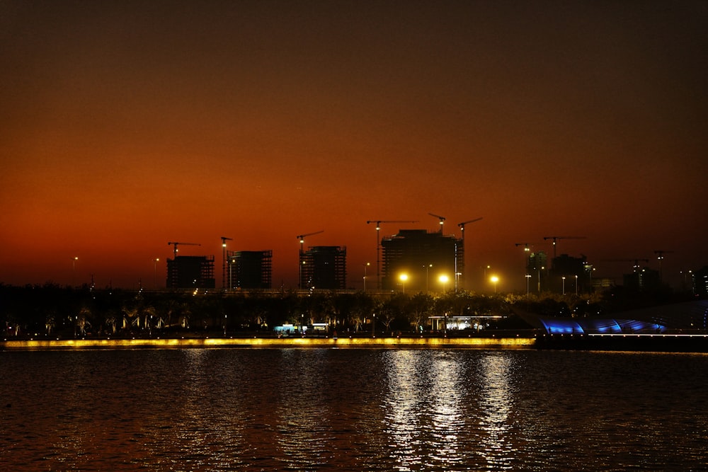 a body of water with a city in the background