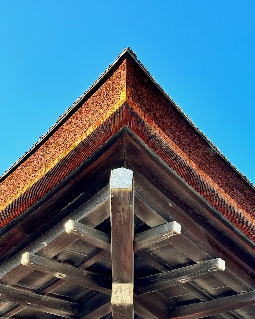 a close up of a wooden structure with a sky background