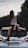 a woman sitting on the back of a car