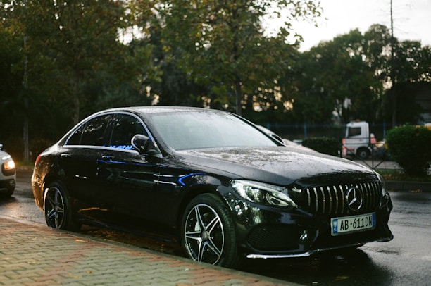 a black car parked on the side of the road