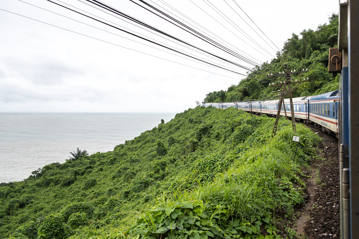 Scenic railway train traversing sunny countryside tracks