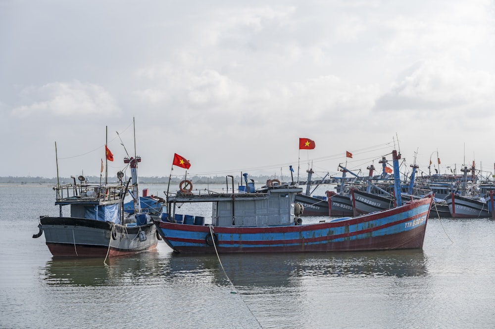 a group of boats that are sitting in the water