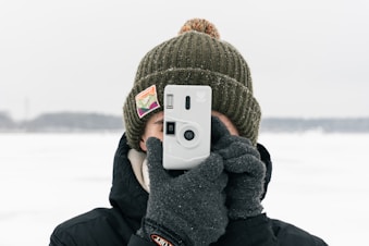 a person taking a picture with a camera