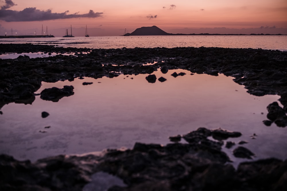 a body of water surrounded by rocks and rocks