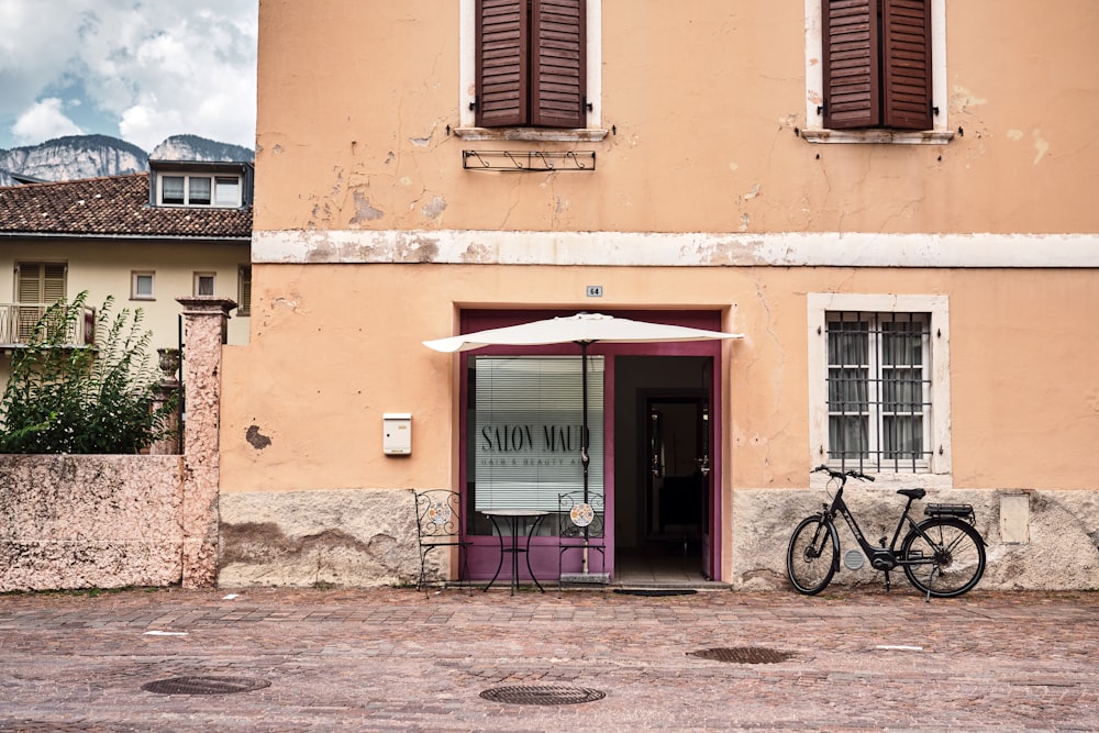 a bicycle is parked outside of a building