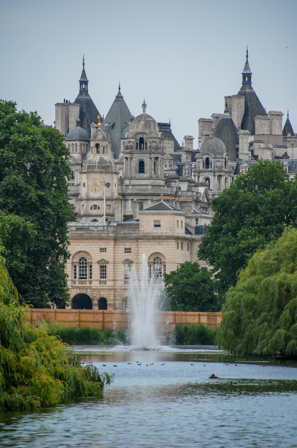 a large building with a fountain in front of it