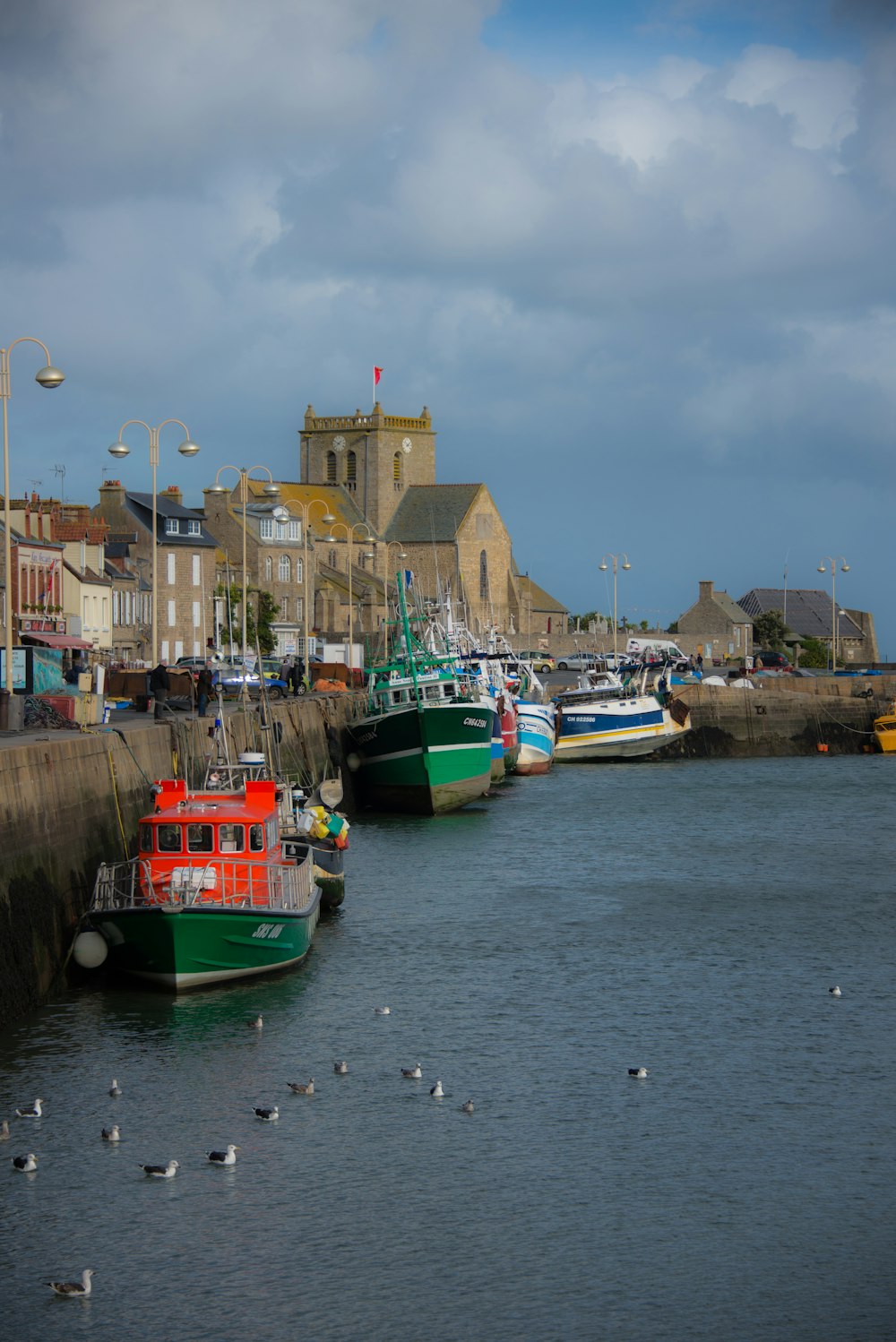 a group of boats that are sitting in the water