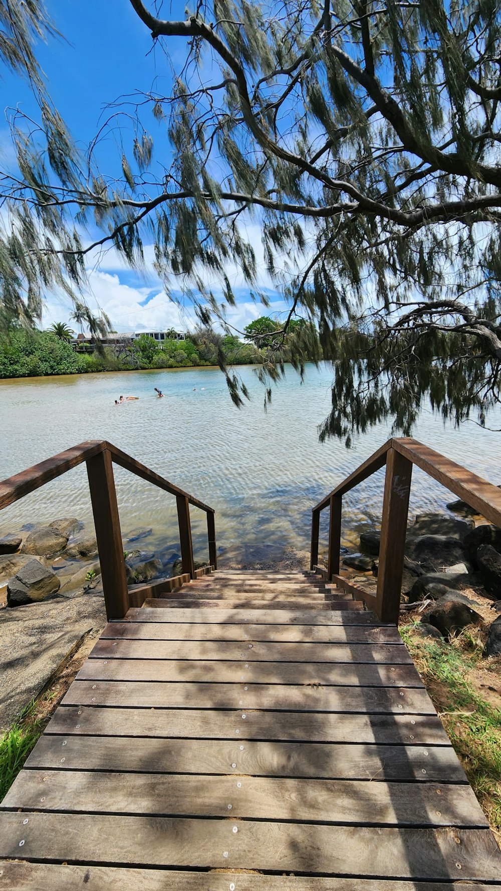 a wooden bridge over a body of water