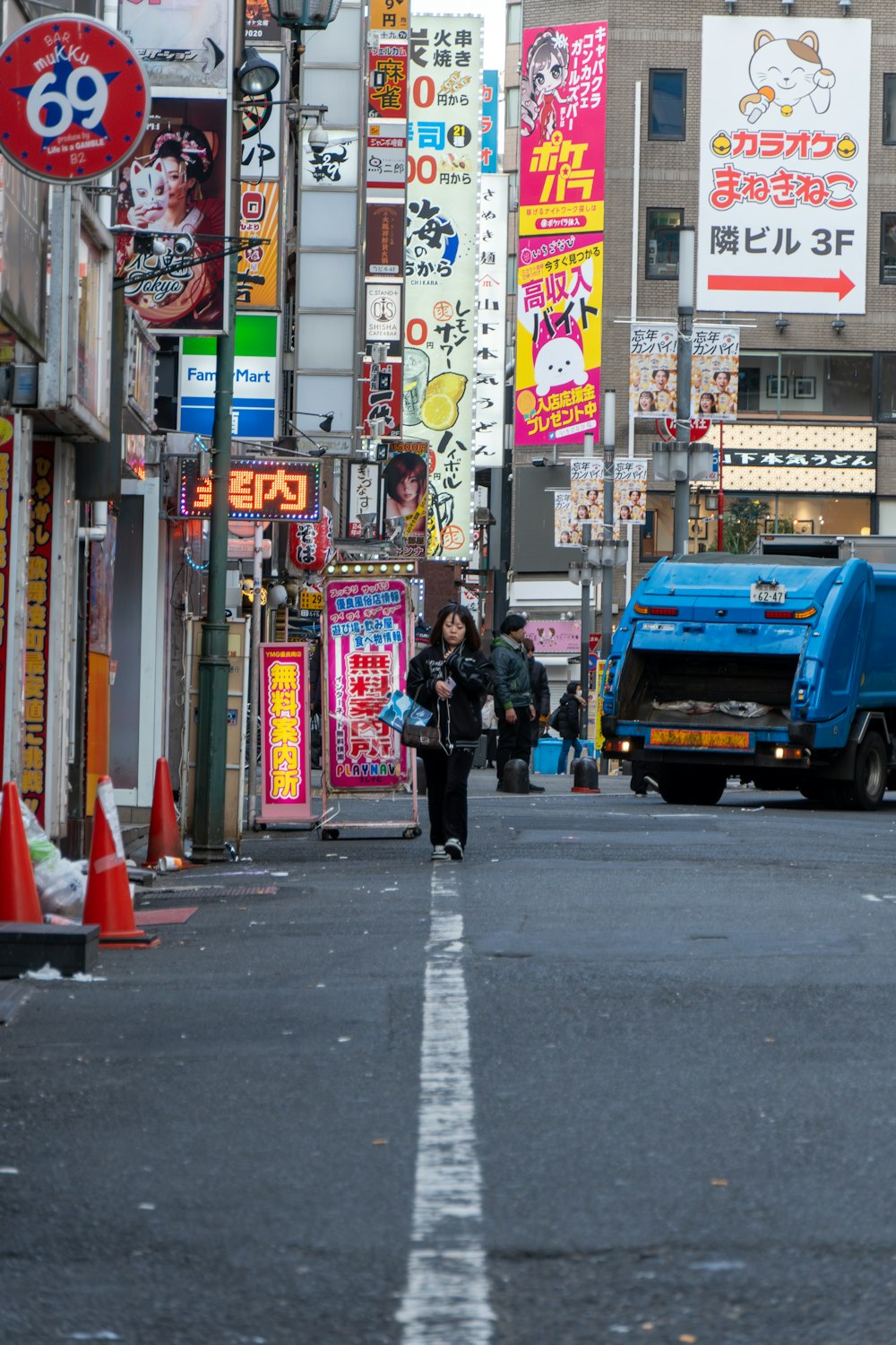 a city street filled with lots of tall buildings