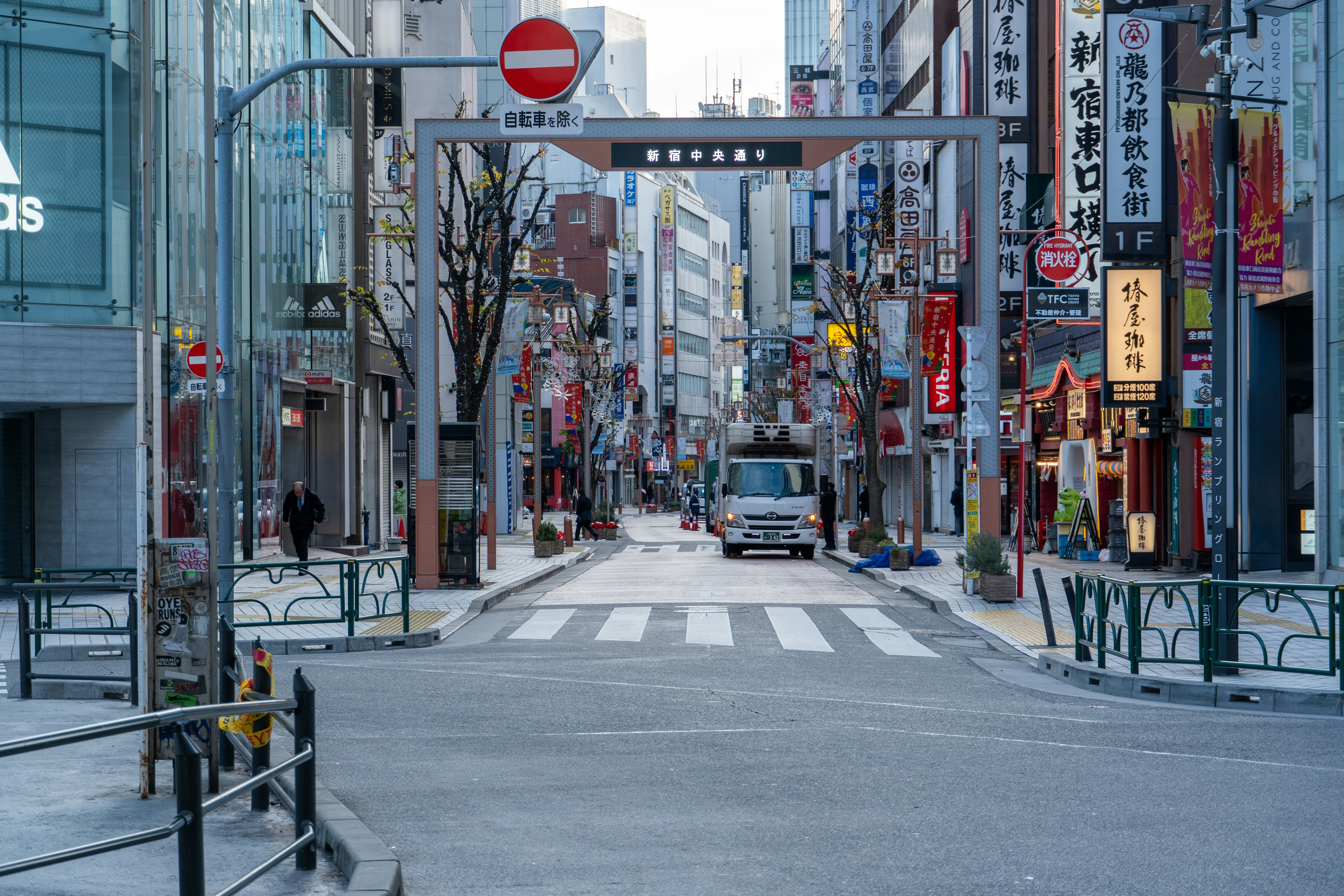 a city street filled with lots of tall buildings