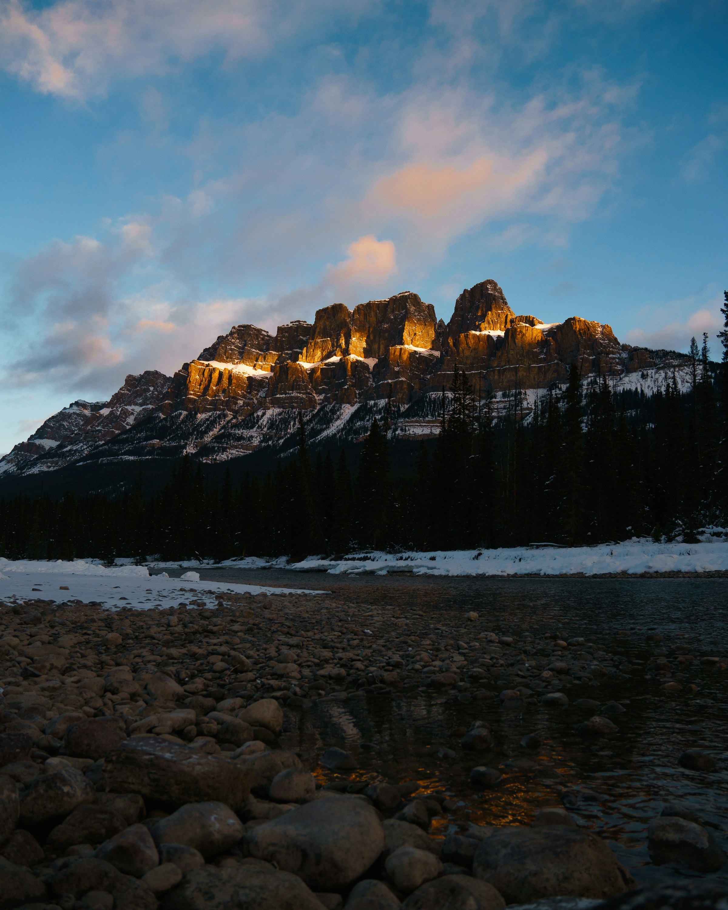 a mountain is lit up at night in the distance