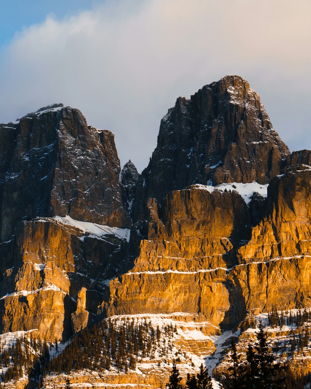 a group of mountains with snow on them