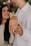 a man and a woman holding hands with wedding rings