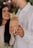 a man and a woman holding hands with wedding rings