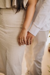 a close up of a person holding the hand of a person