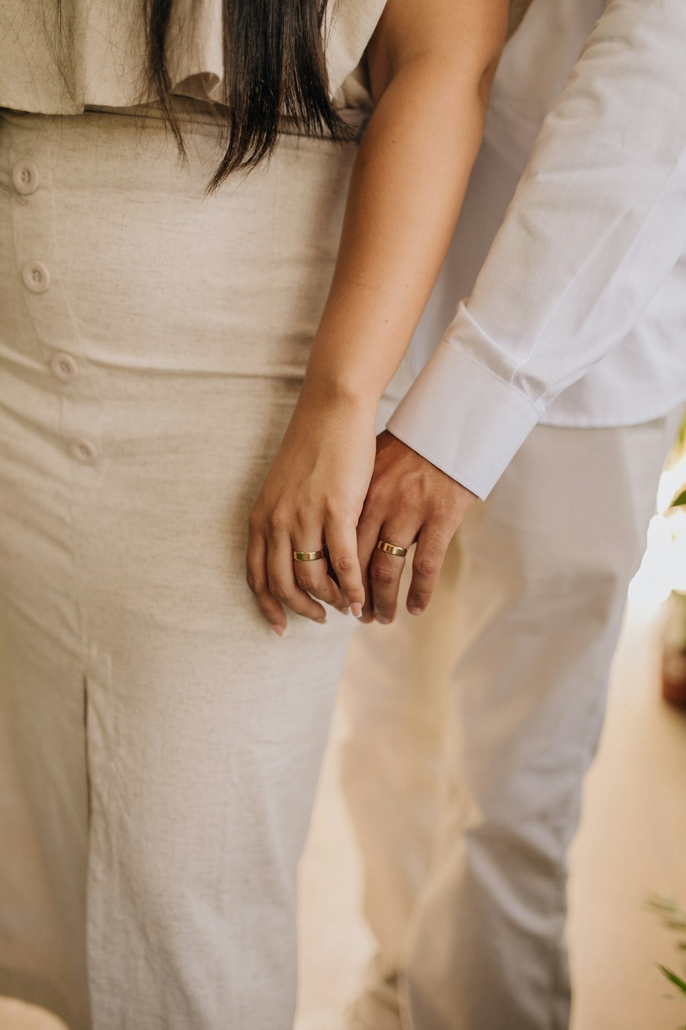 a close up of a person holding the hand of a person