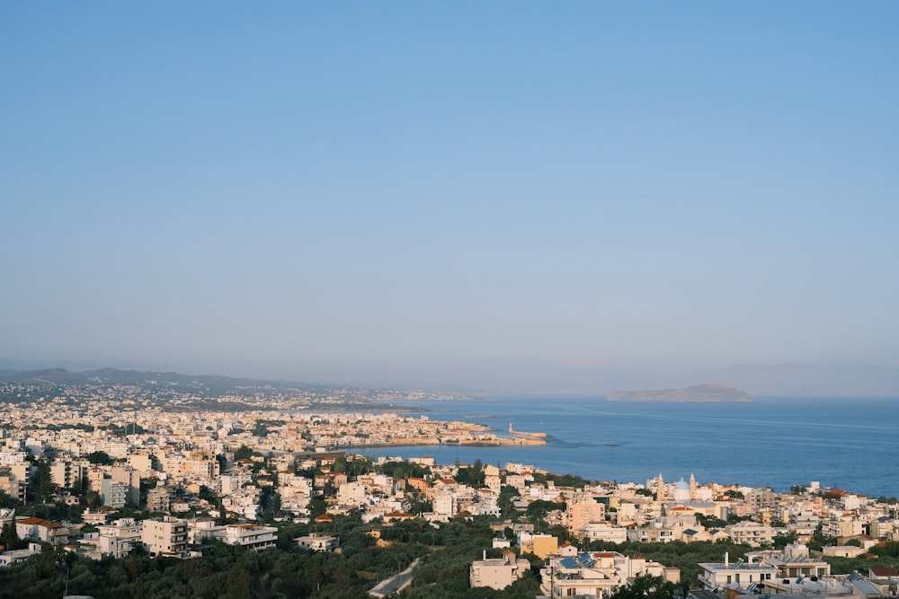 a view of a city with a body of water in the background