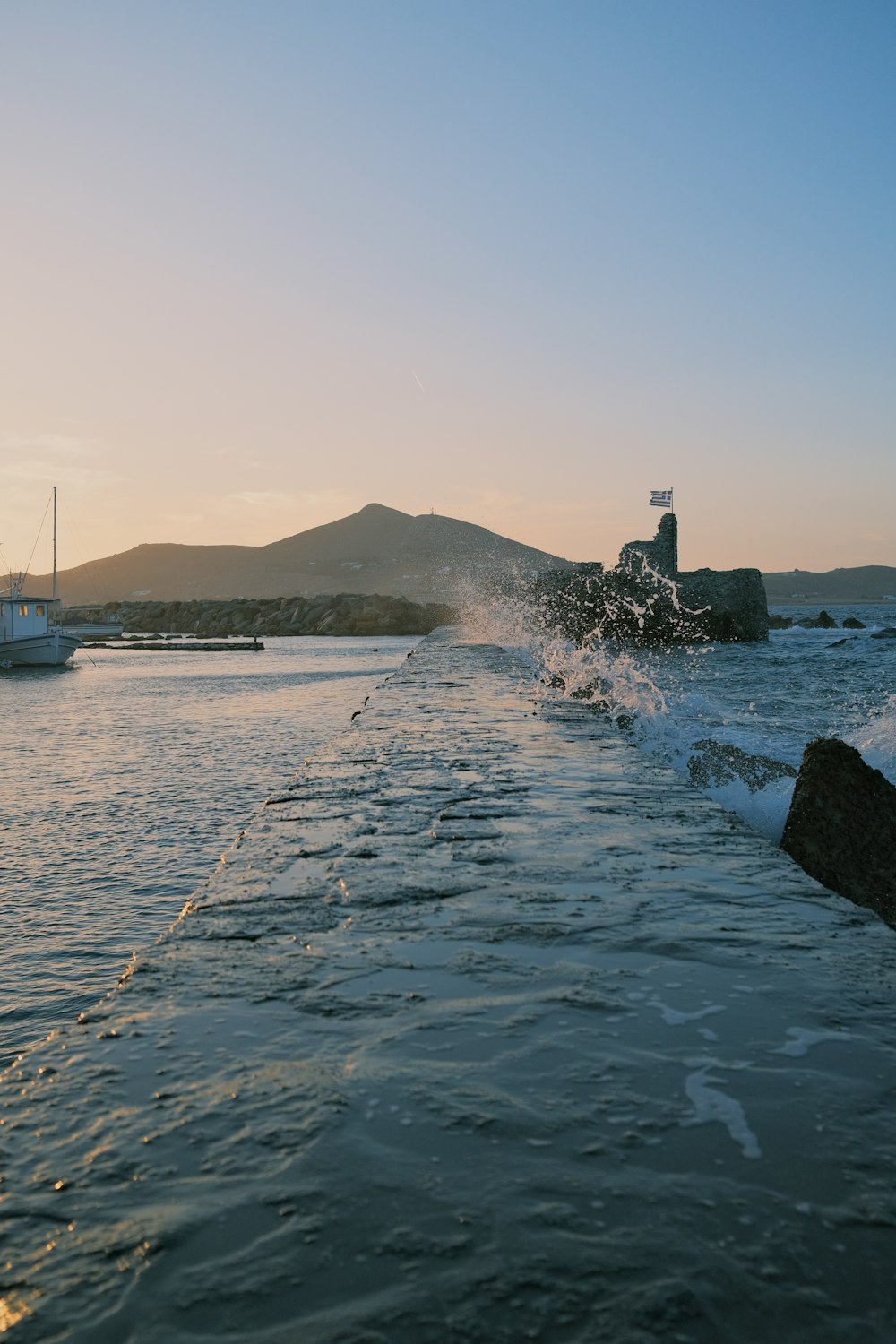 a body of water with a boat in the distance