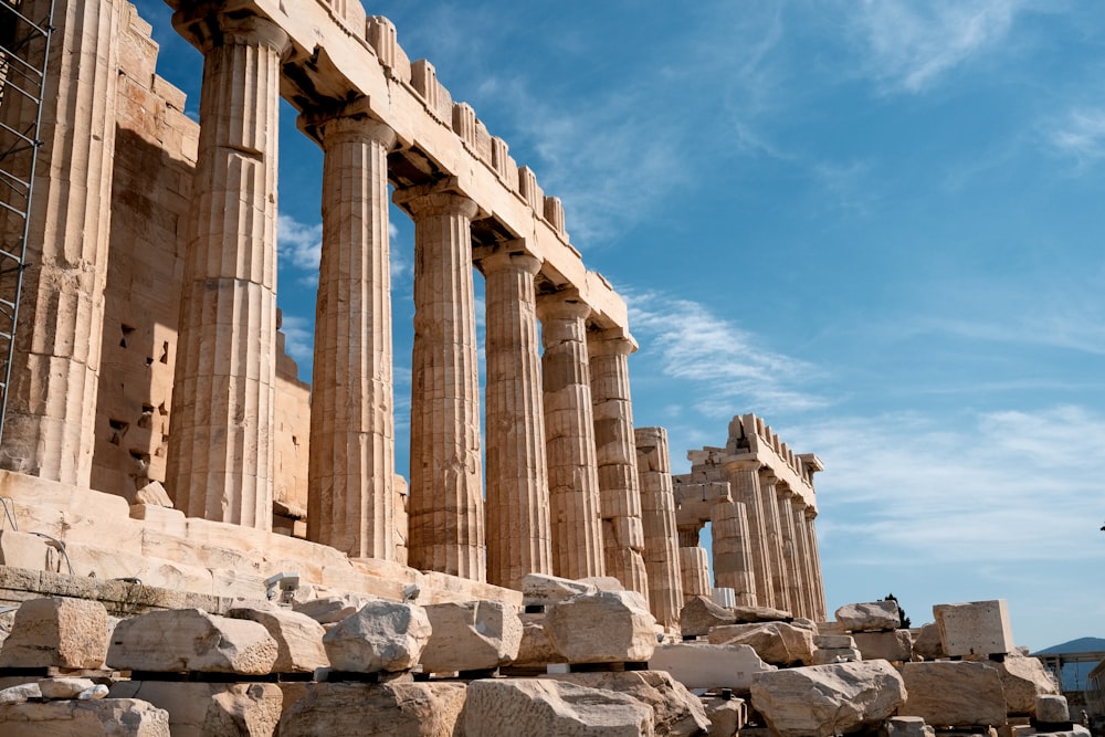 a row of stone pillars sitting next to each other