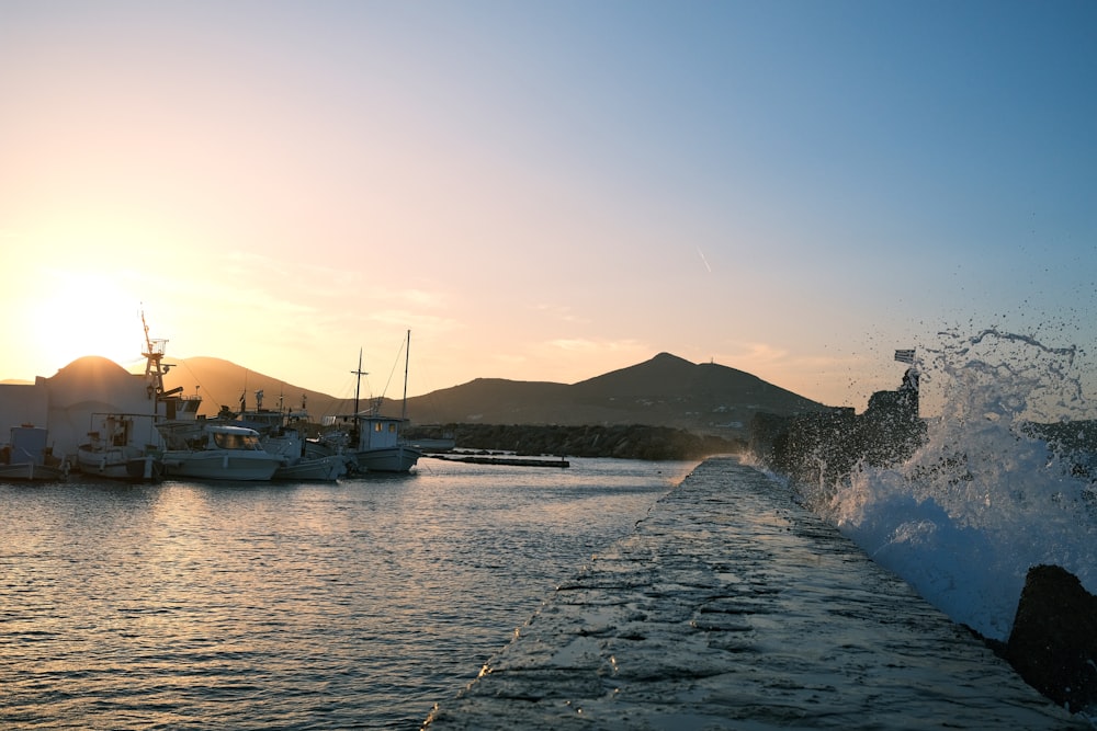 a body of water with boats in the background