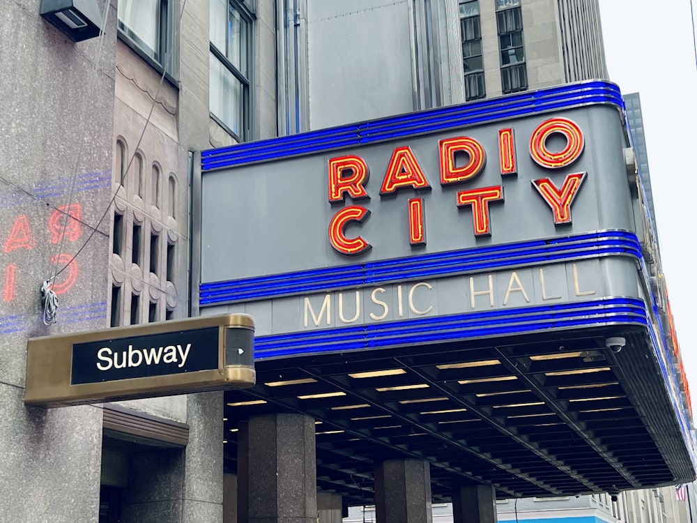 a radio city music hall sign on a city street