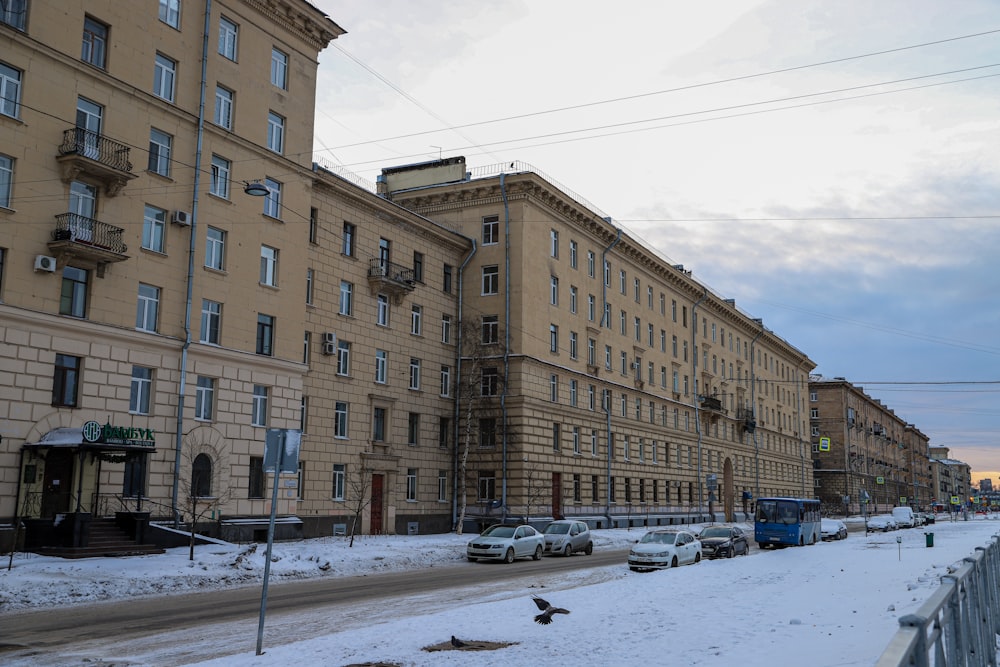 a row of buildings on a snowy street