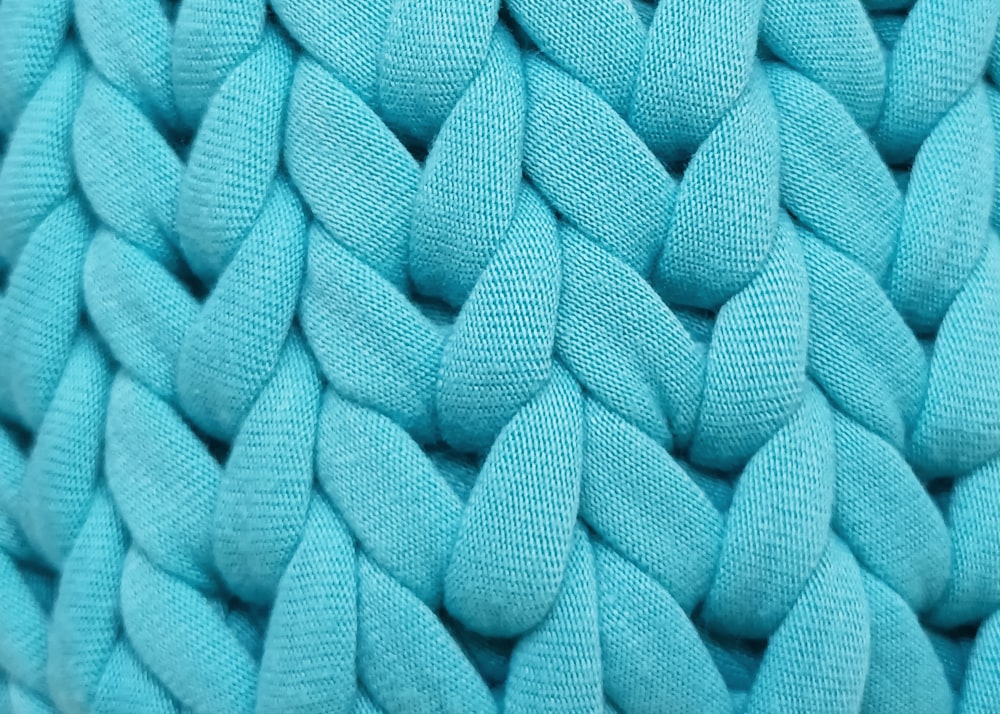 a close up of a blue knitted material