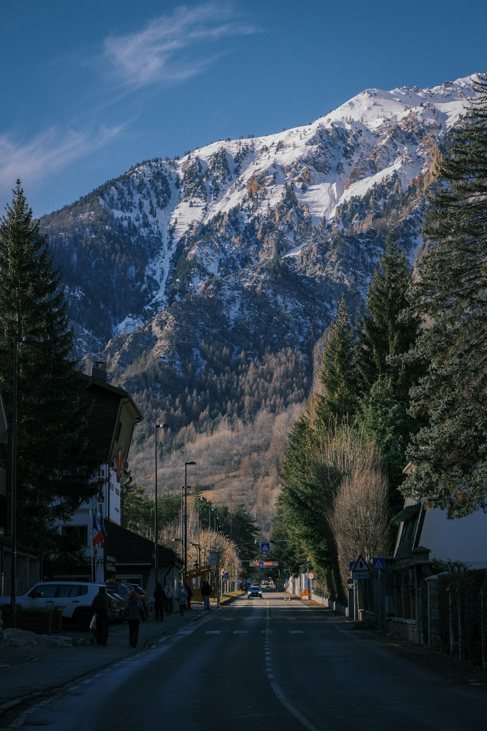 a street with a mountain in the background
