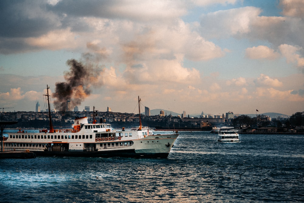 a large white boat floating on top of a body of water